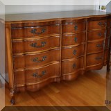 F55. Twelve-drawer dresser with matching mirror. 35”h x 64”w x 21”d 